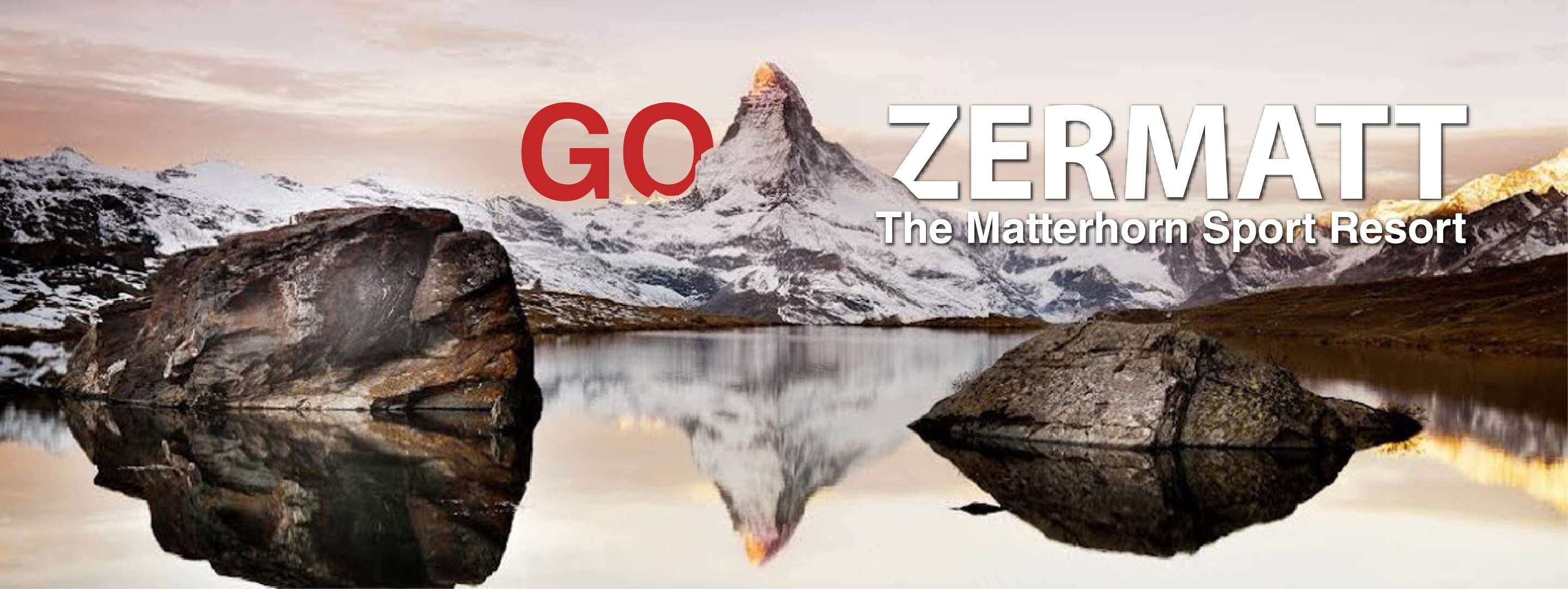 GO ZERMATT — The Matterhorn Sport Resort. Matterhorn reflected in a still alpine lake.